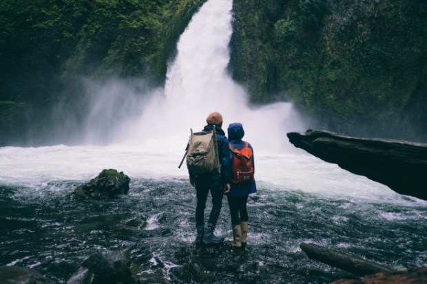Man and woman at waterfall