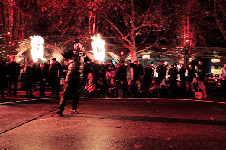 Another member of Flamewater Circus entertains the crowd outside the Feast.