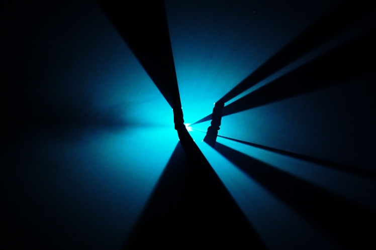 Our friend Niall does a handstand in the middle of the horizontal lights.