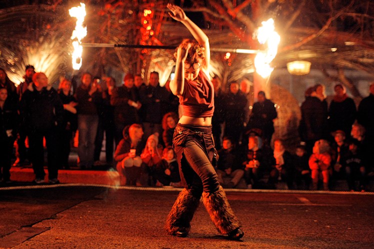 Bella Fuego from Flamewater Circus in the middle of a routine.