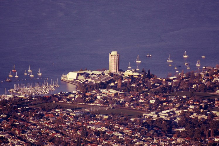 Wrest Point Casino juts out beyond the low lying houses of Sandy Bay.